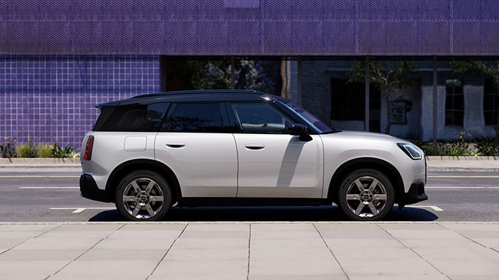 Roadside Assistance. MINI Countryman parked on a street.